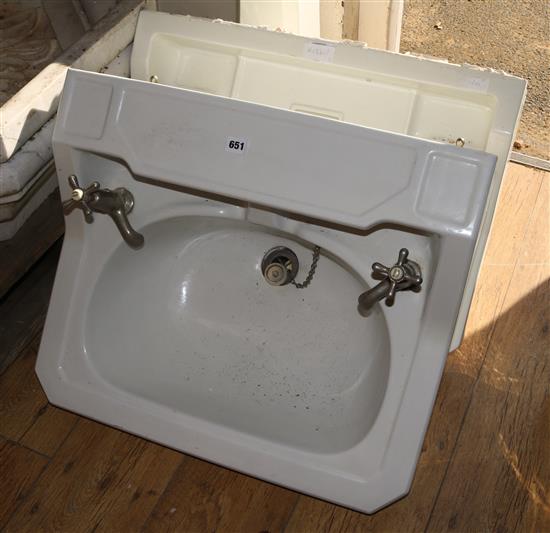 A Twyford & Sons Duramant wash basin, with taps, another similar wash basin and a pedestal